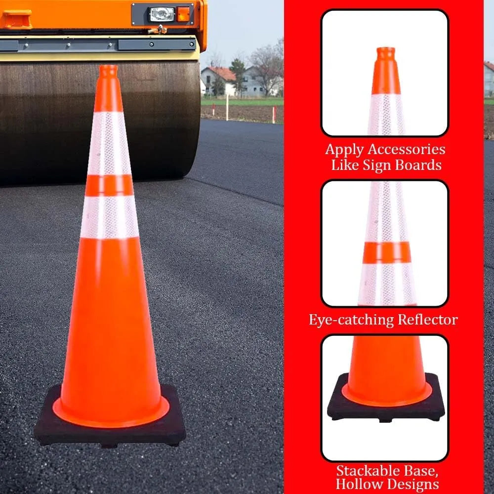 Orange traffic cone on a road with construction equipment