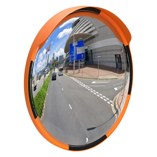 Convex traffic mirror with orange frame reflecting a road scene.