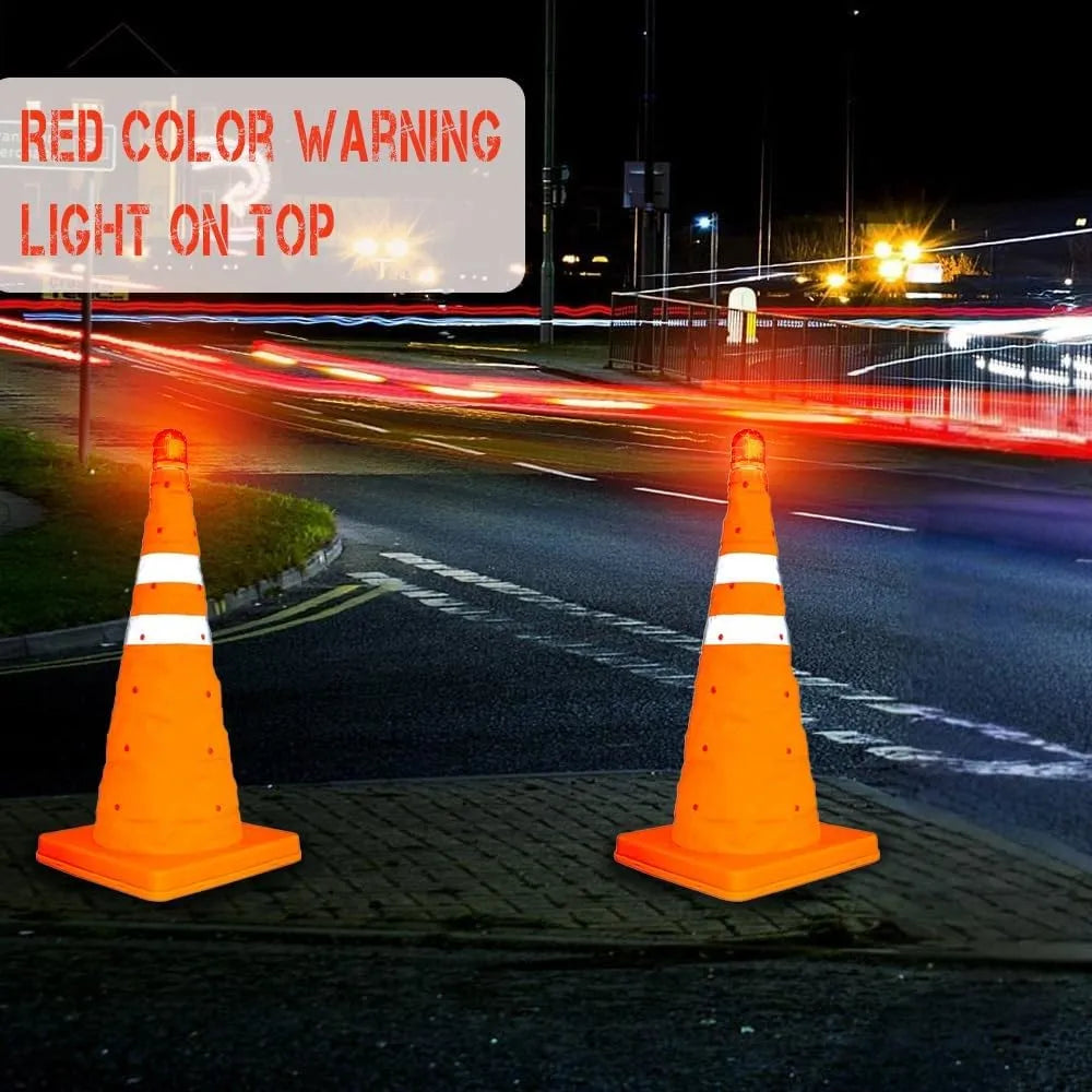 Two orange traffic cones on a road with a red warning sign