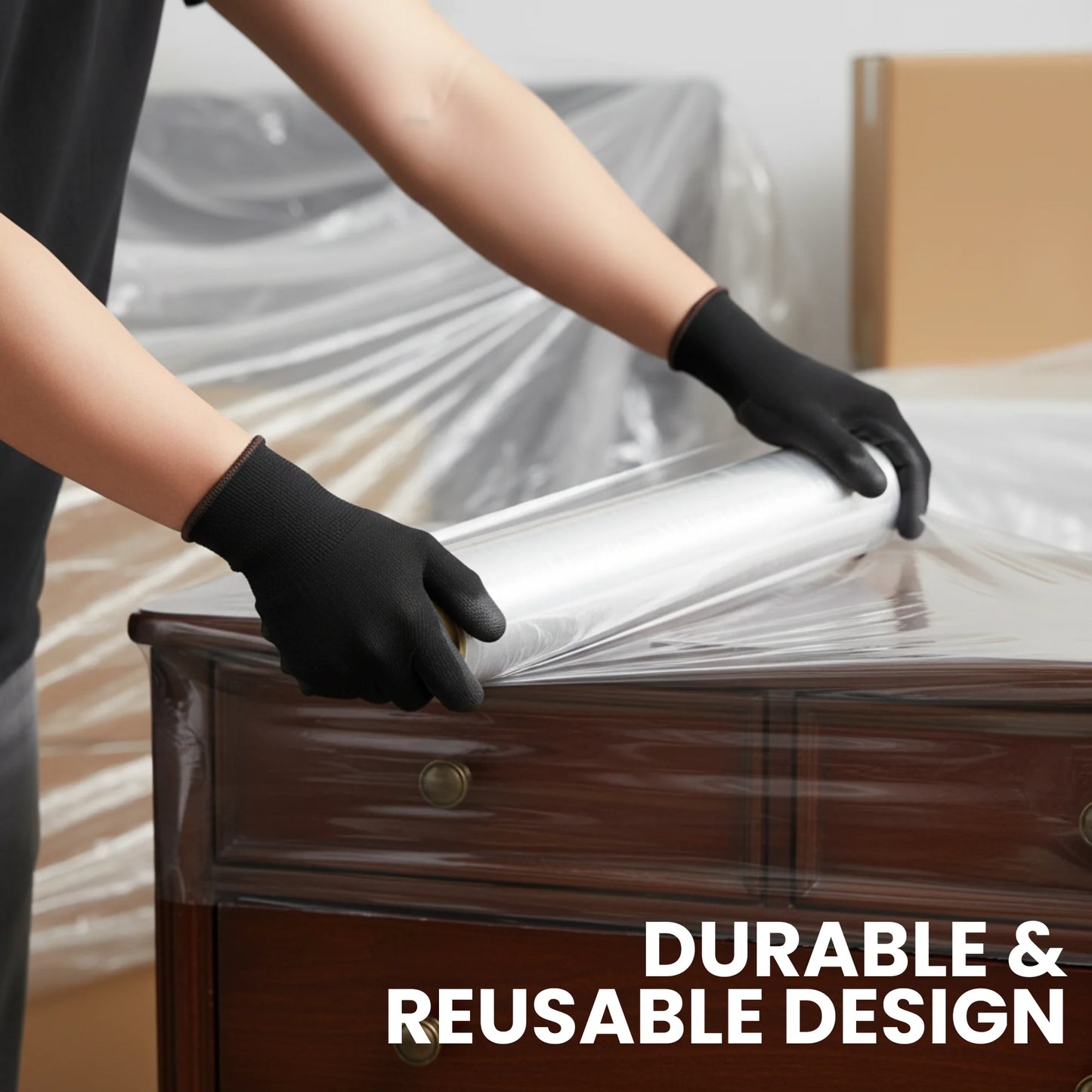 Worker wearing Berry black XL work gloves while wrapping furniture with stretch film