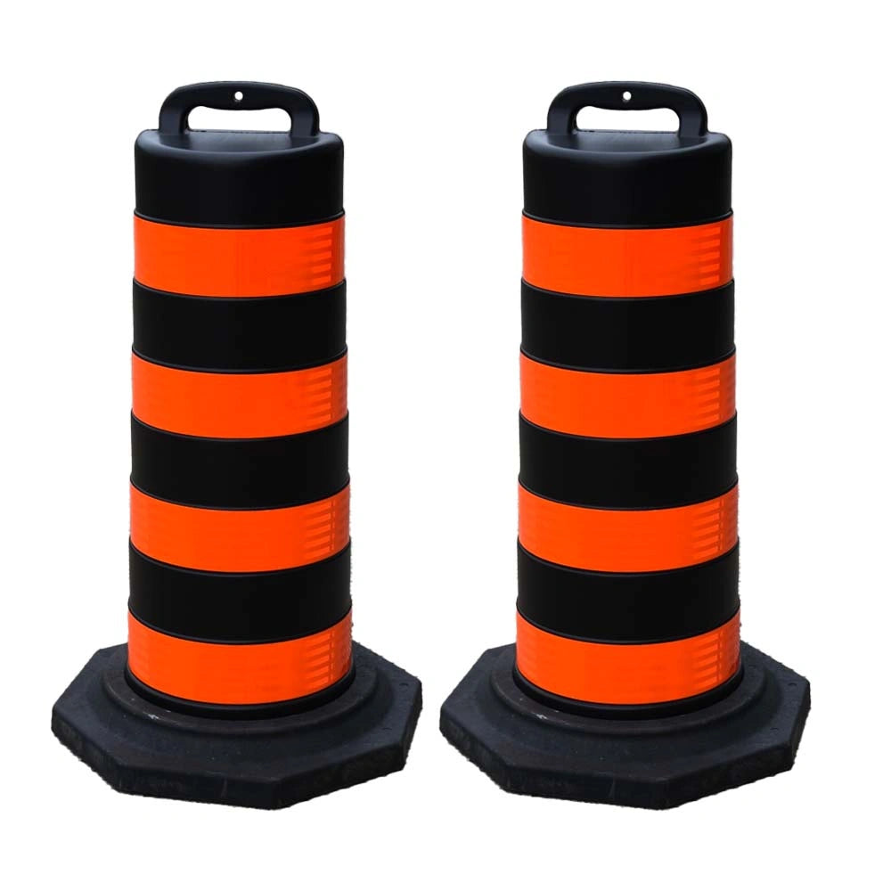 Two black and orange striped traffic safety barrel 