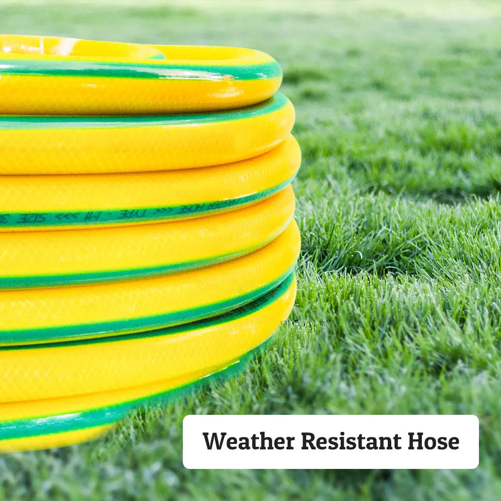 Yellow and green weather resistant hose coiled on grass