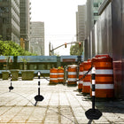 City street with traffic cones and barriers Chain