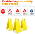 Yellow safety sign stands with customizable warning signs on a white background