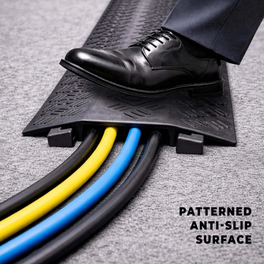 Patterned anti-slip surface cable cover with a black shoe stepping 