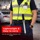 Person wearing a high-visibility vest with a tool, set against 