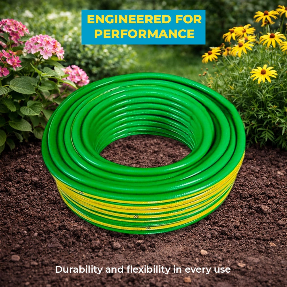green and yellow garden hose on soil with flowers 