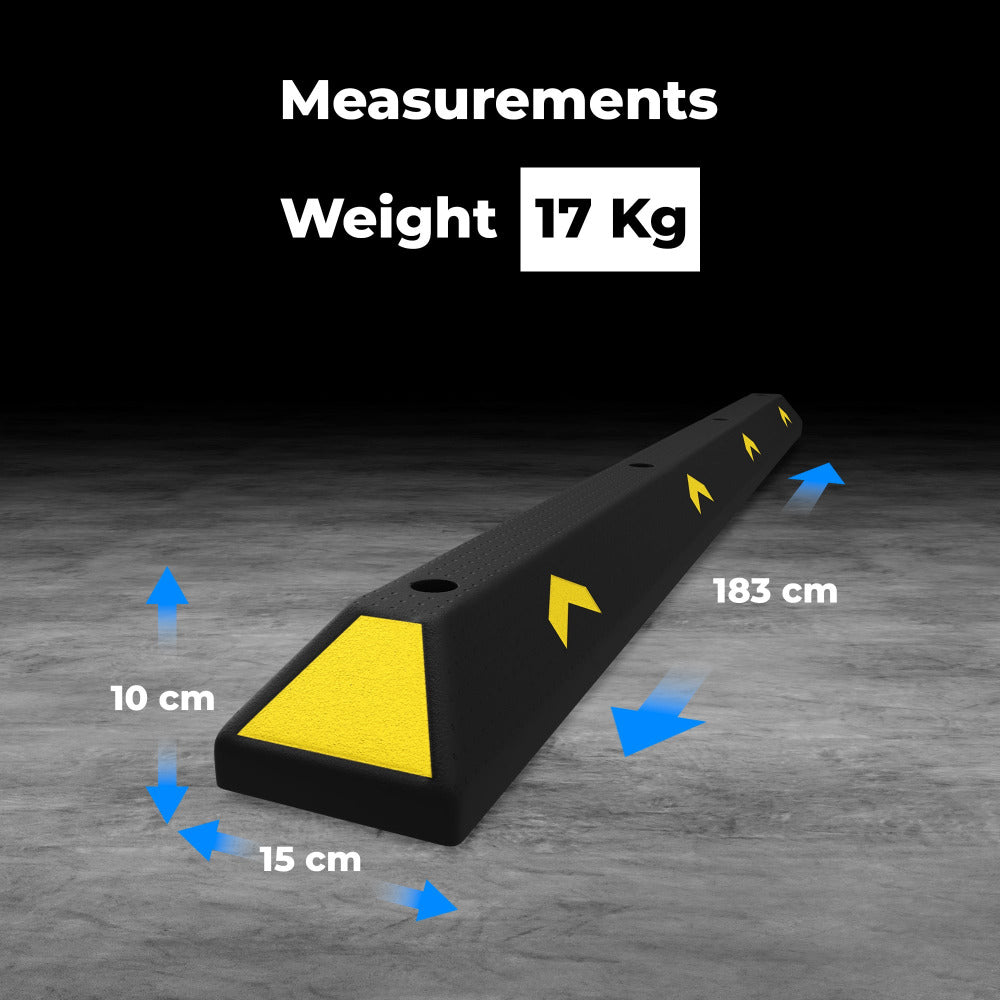 Black and yellow wheel stopper with measurements and weight displayed on a gray floor.