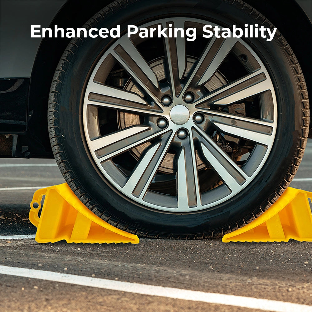 Car tire on a yellow parking block with 'Enhanced Parking Stability' text