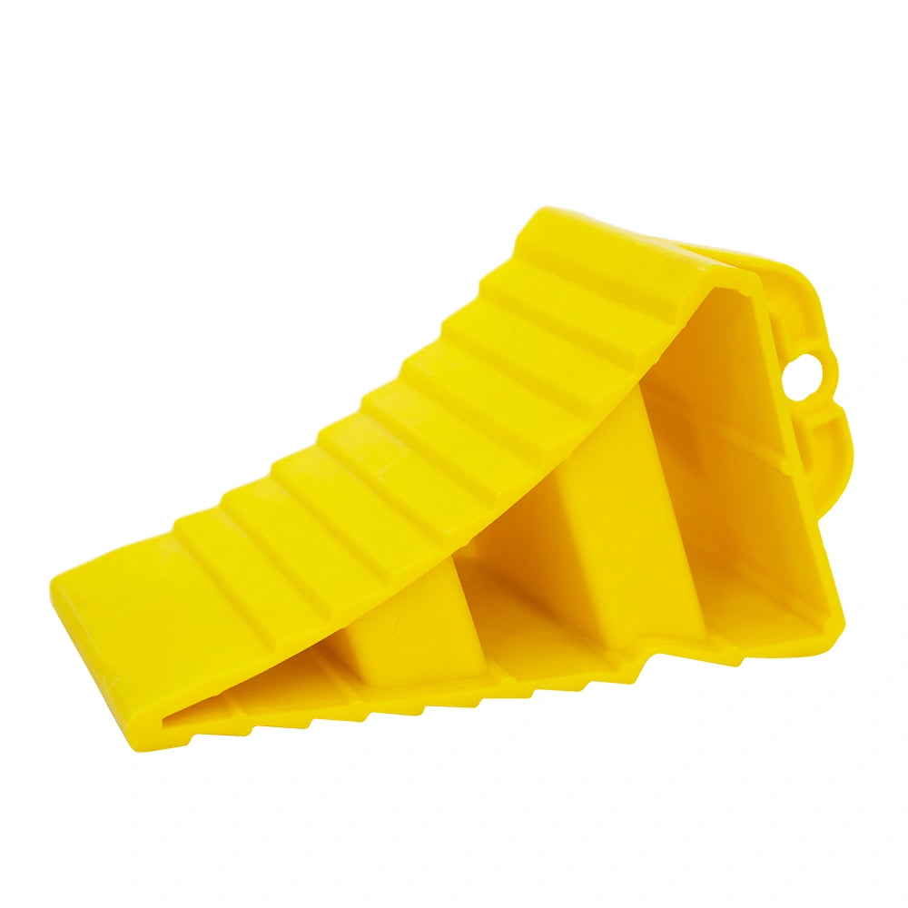 Yellow plastic wheel stopper on a white background