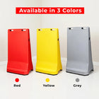 Three colorful stands (red, yellow, gray) 