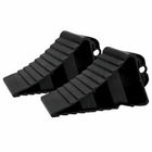 Two black plastic wedges on a white background