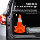 Stack of orange traffic cones in a car trunk 