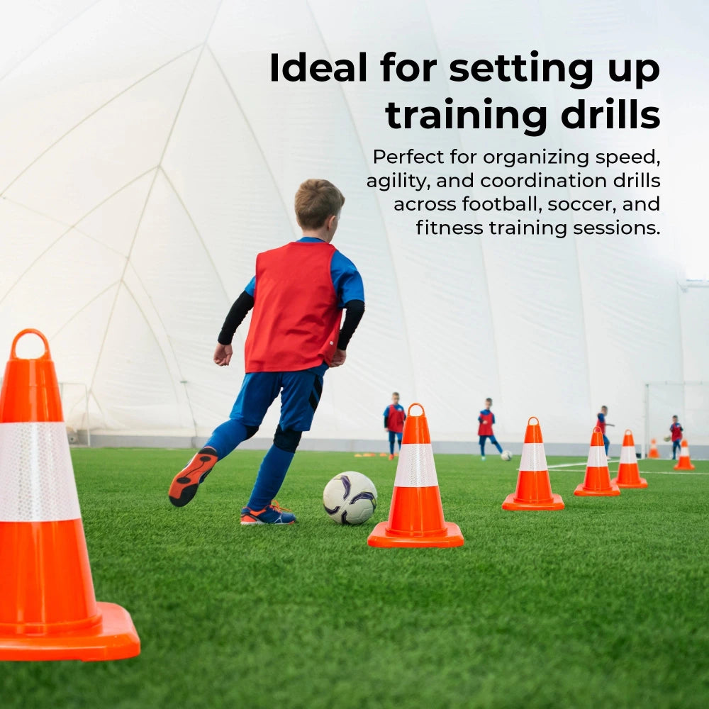 Child practicing soccer drills with cones on a sports field