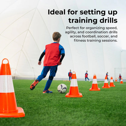 Child practicing soccer drills with cones on a sports field