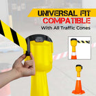 Yellow traffic cone topper tape with black handle, holding a yellow and black striped cone, 