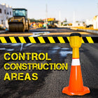 Road construction scene with a traffic cone and warning tape