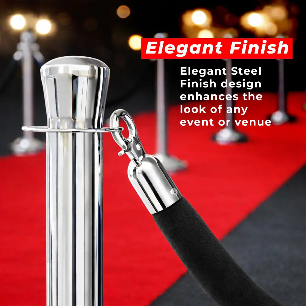 Silver stanchion with black rope on a red carpet