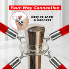 Metal four-way connection with red hoses