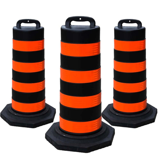 Three black and orange striped traffic barrel 
