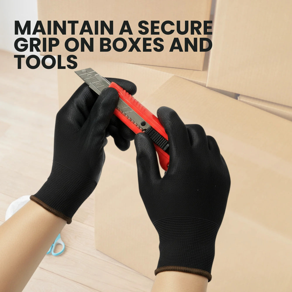Worker wearing Berry black XL work gloves while lifting a cardboard box